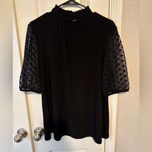 Elegant Black Top with Sheer Polka Dot Sleeves